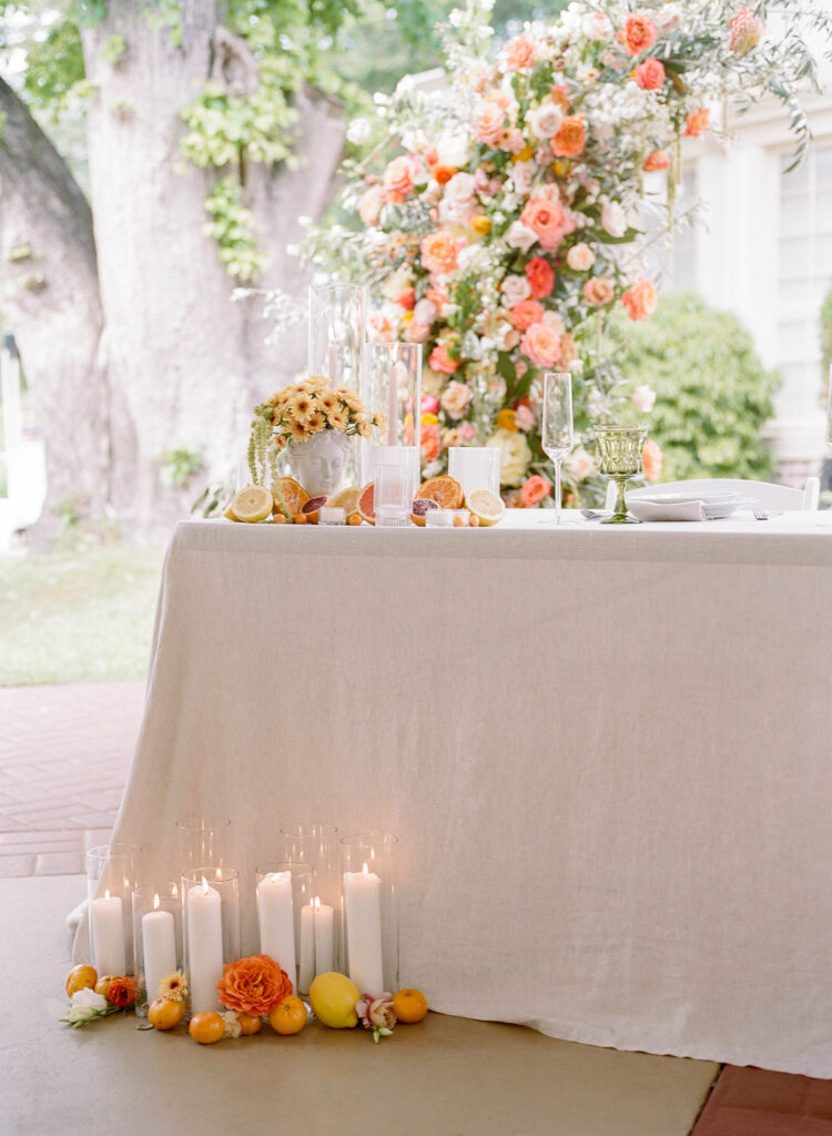 tuscany inspired wedding decor with roses and citrus fruit